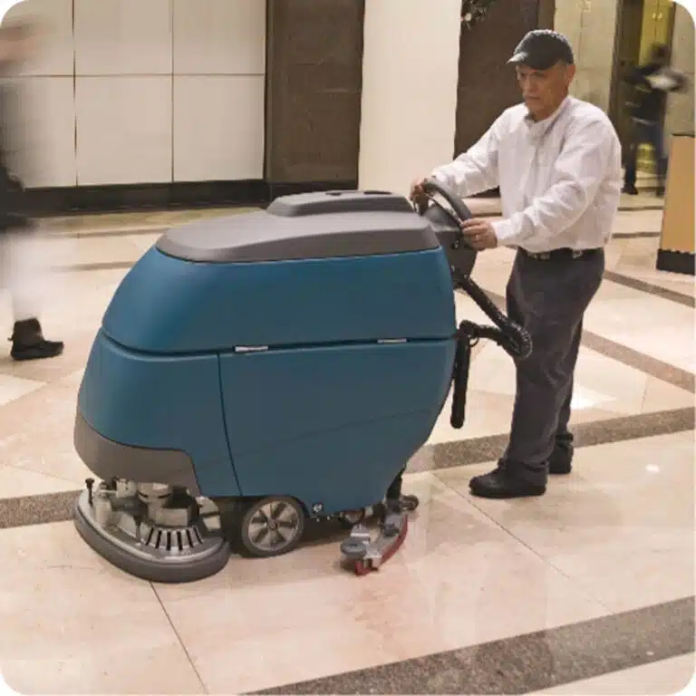 Man cleaning a commercial stone floor
